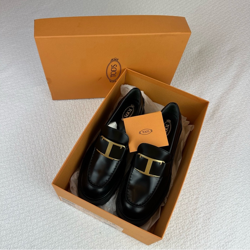 Tod's Black Leather Slip-On Loafers with Gold Accents
